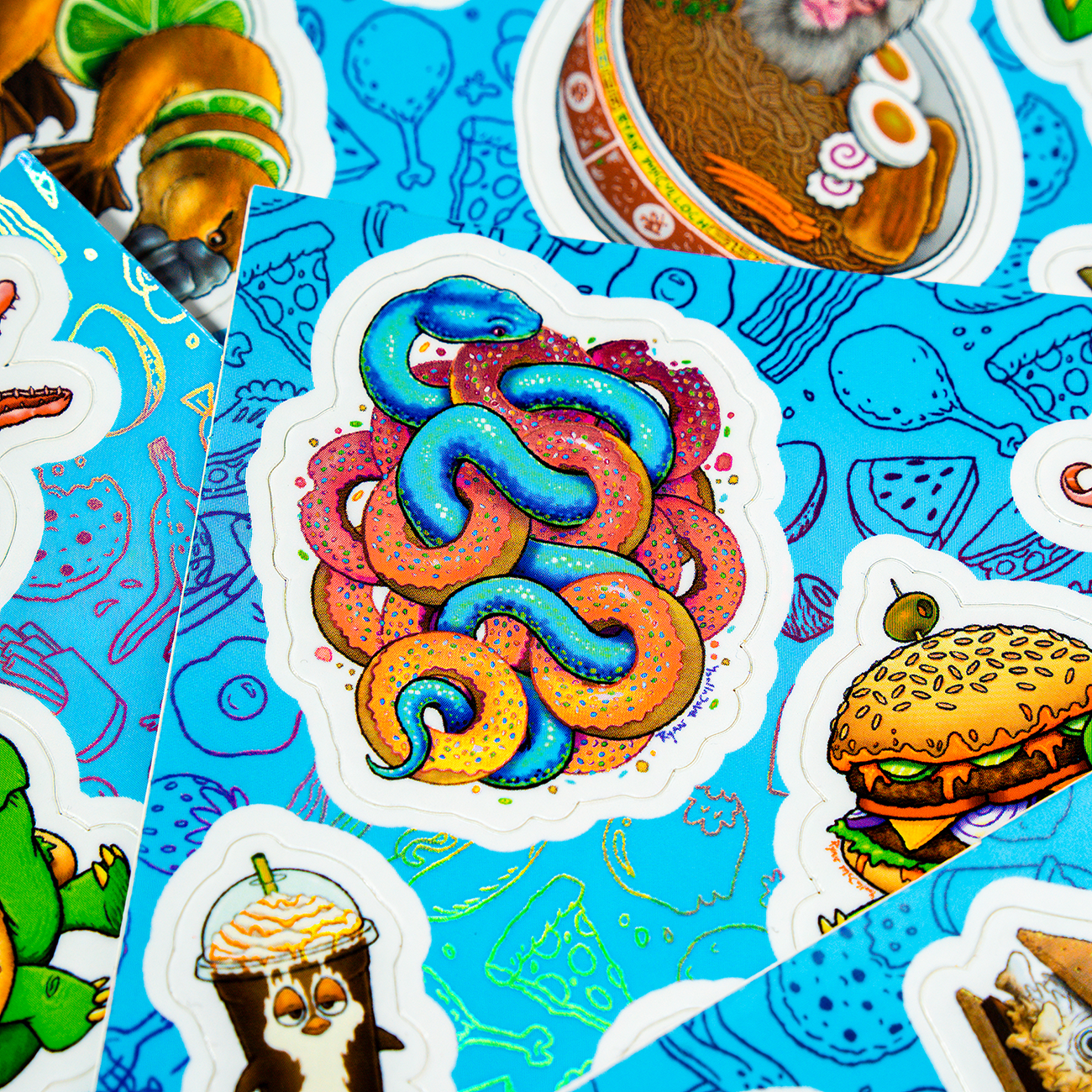 holographic snake covered in pink donuts, against a blue background