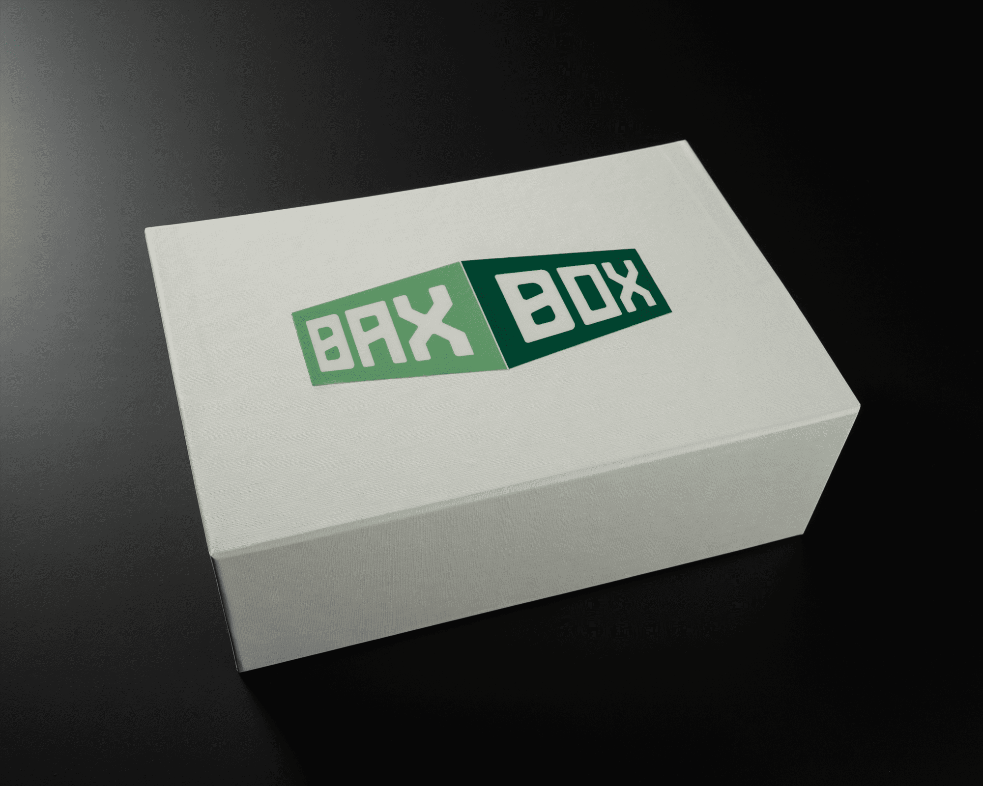 En vit låda med en grön UV DTF transferklistermärke med texten "BAX BOX" på locket.