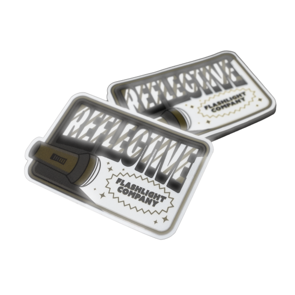 Reflekterande klistermärken med en ficklampsdesign, fet text och etiketten ”Flashlight Company”.