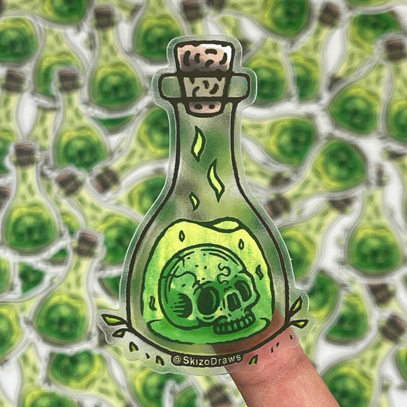 Transparent die-cut klistermärke av en dödskalle som flyter i en flaska med grönt elixir, mot en bakgrund av klistermärken.